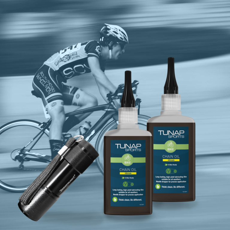 Two Chain Oil Ultimate Bottles and UV Pocket Torch, cyclist in background